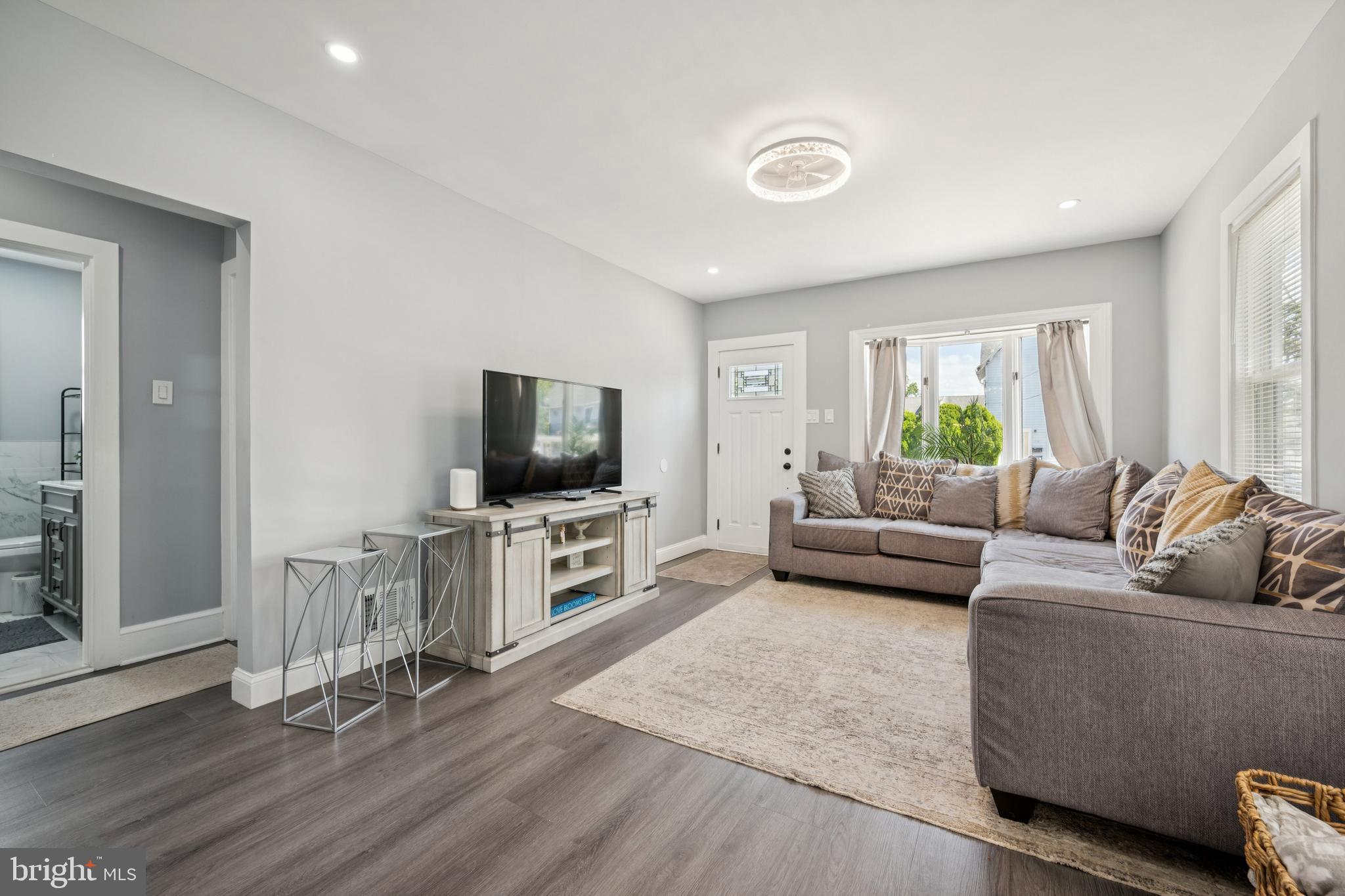 259 Hooker Street Riverside, NJ 08075 - Photo 6 of 25 a living room with furniture and a flat screen tv