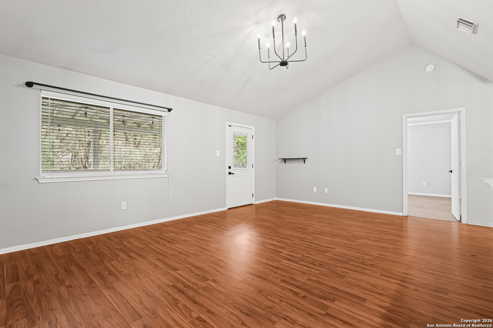 162 Canyon View Court Spring Branch, TX 78070 - Photo 16 of 44 a view of empty room with wooden floor and window