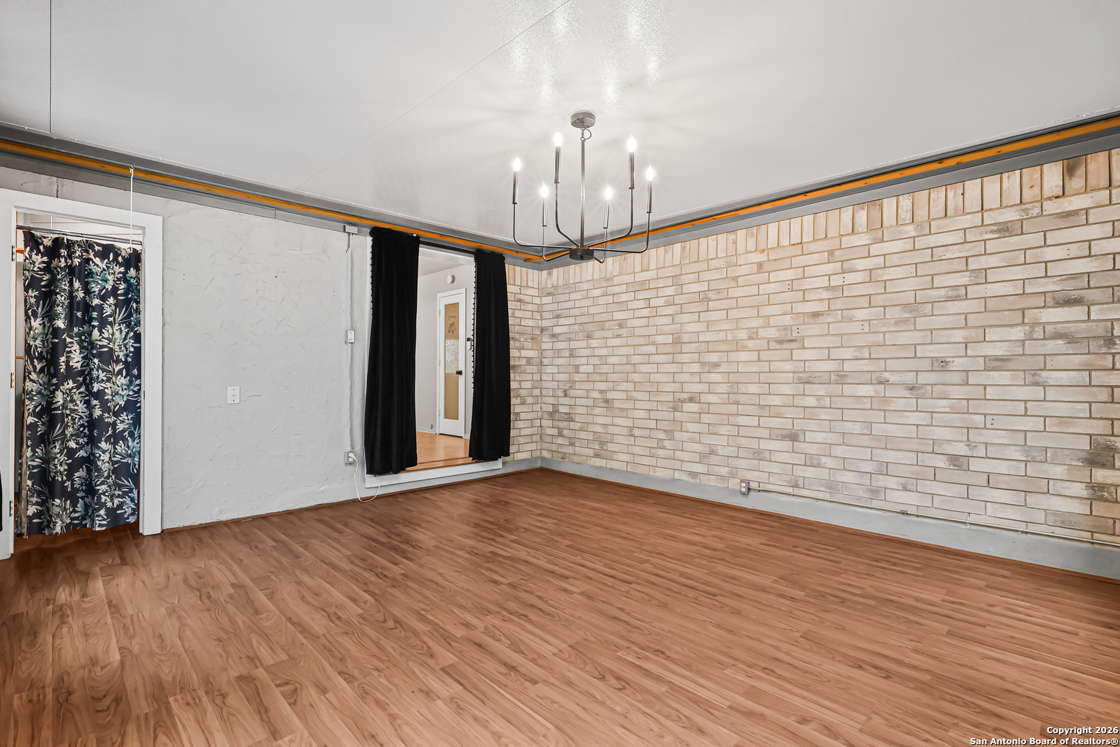 162 Canyon View Court Spring Branch, TX 78070 - Photo 24 of 44 a view of an empty room with wooden floor and a window
