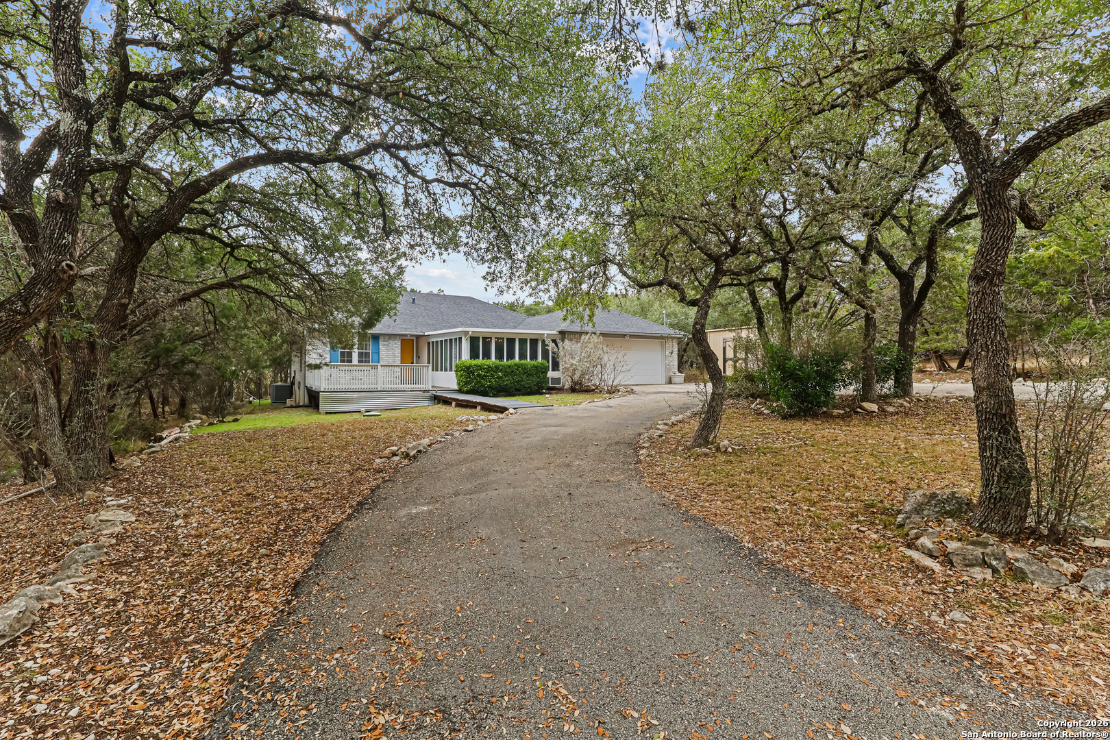162 Canyon View Court Spring Branch, TX 78070 - Photo 3 of 44 a house with trees in front of it