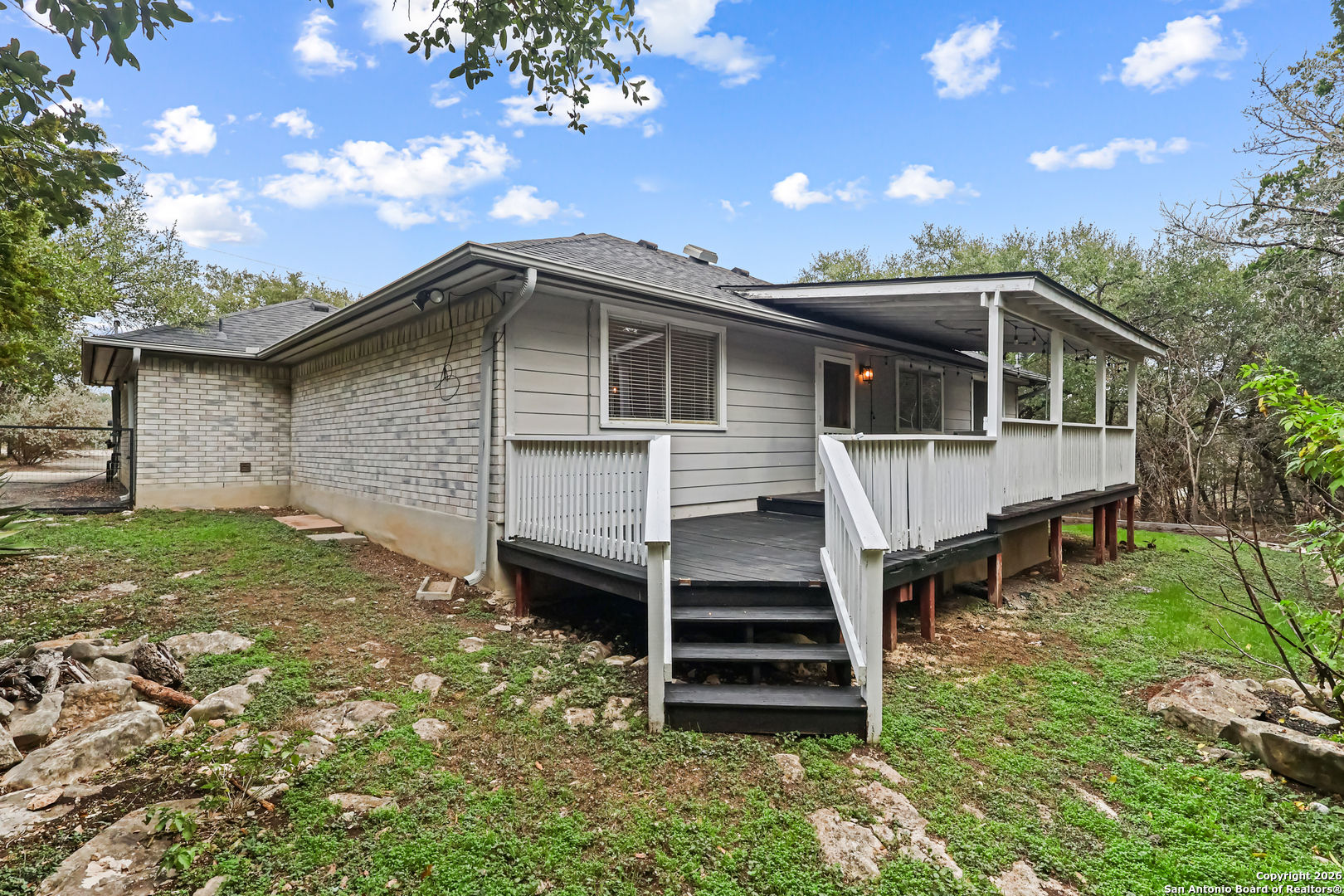 162 Canyon View Court Spring Branch, TX 78070 - Photo 37 of 44 a front view of a house with a garden