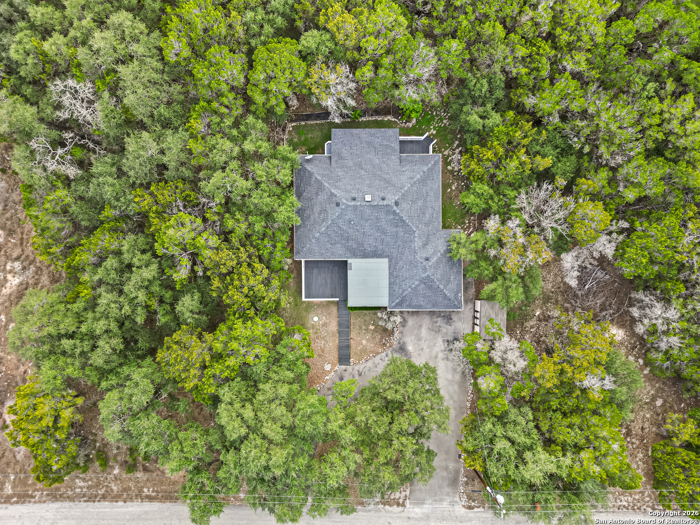 162 Canyon View Court Spring Branch, TX 78070 - Photo 40 of 44 an aerial view of a house with a yard