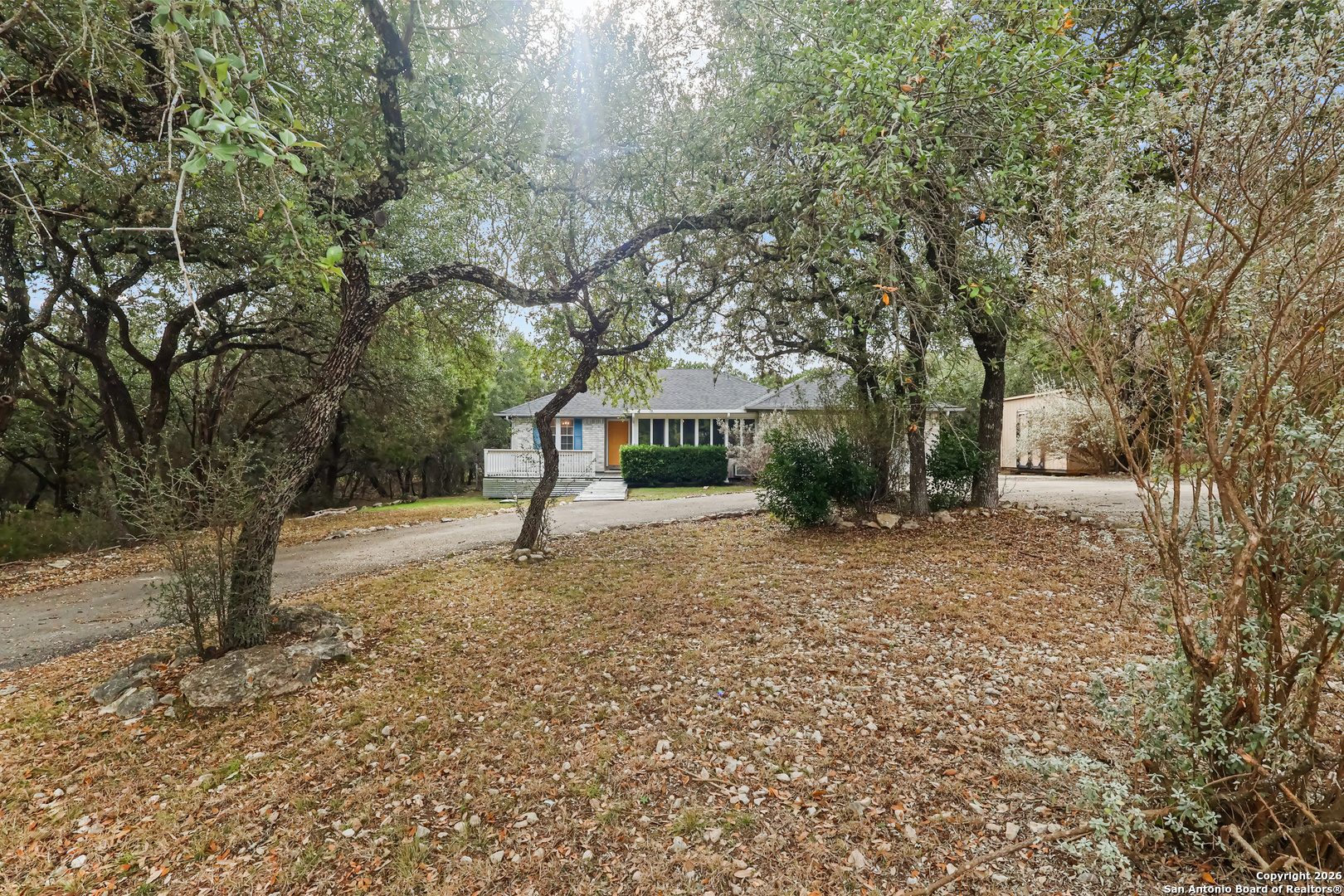 162 Canyon View Court Spring Branch, TX 78070 - Photo 41 of 44 a house with trees in front of it