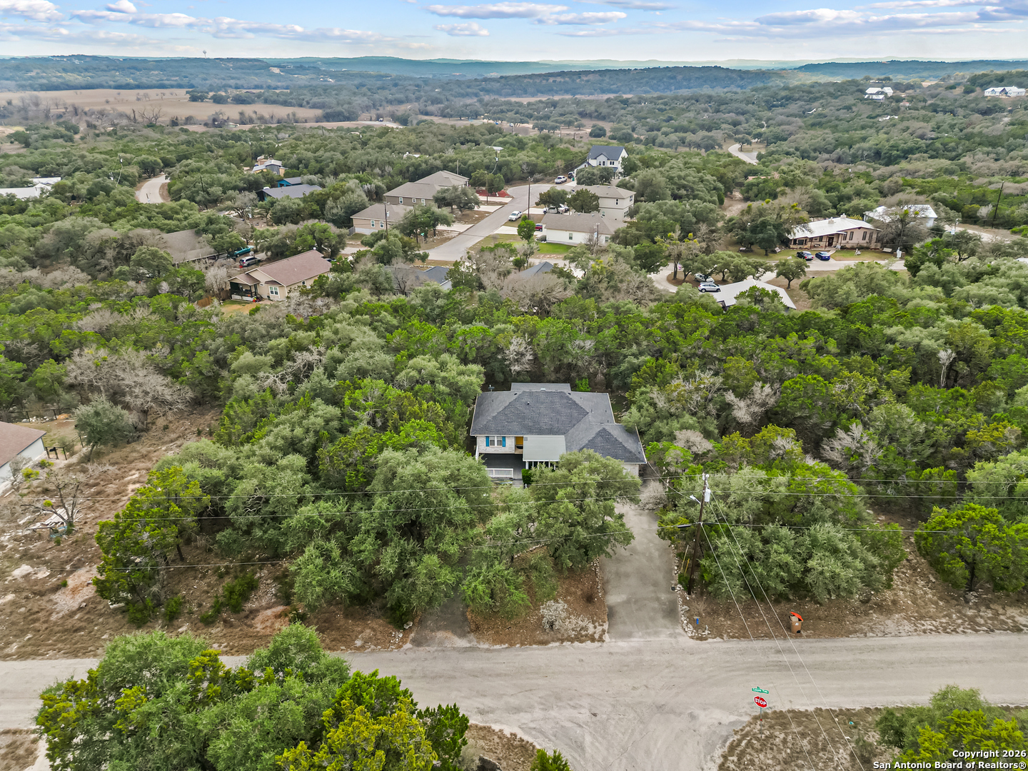 162 Canyon View Court Spring Branch, TX 78070 - Photo 42 of 44 an aerial view of a house with a yard