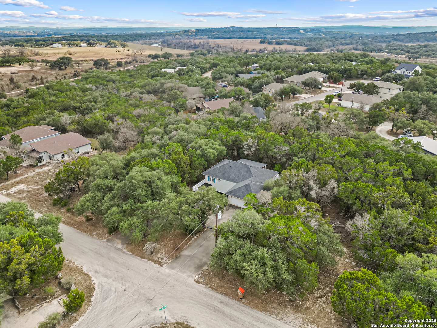 162 Canyon View Court Spring Branch, TX 78070 - Photo 43 of 44 an aerial view of a houses with a yard