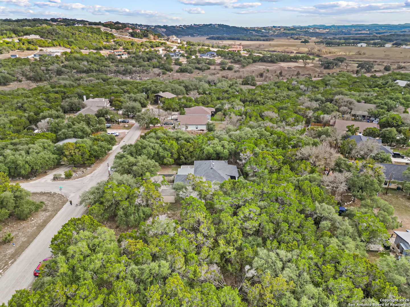 162 Canyon View Court Spring Branch, TX 78070 - Photo 44 of 44 an aerial view of residential houses with outdoor space and trees