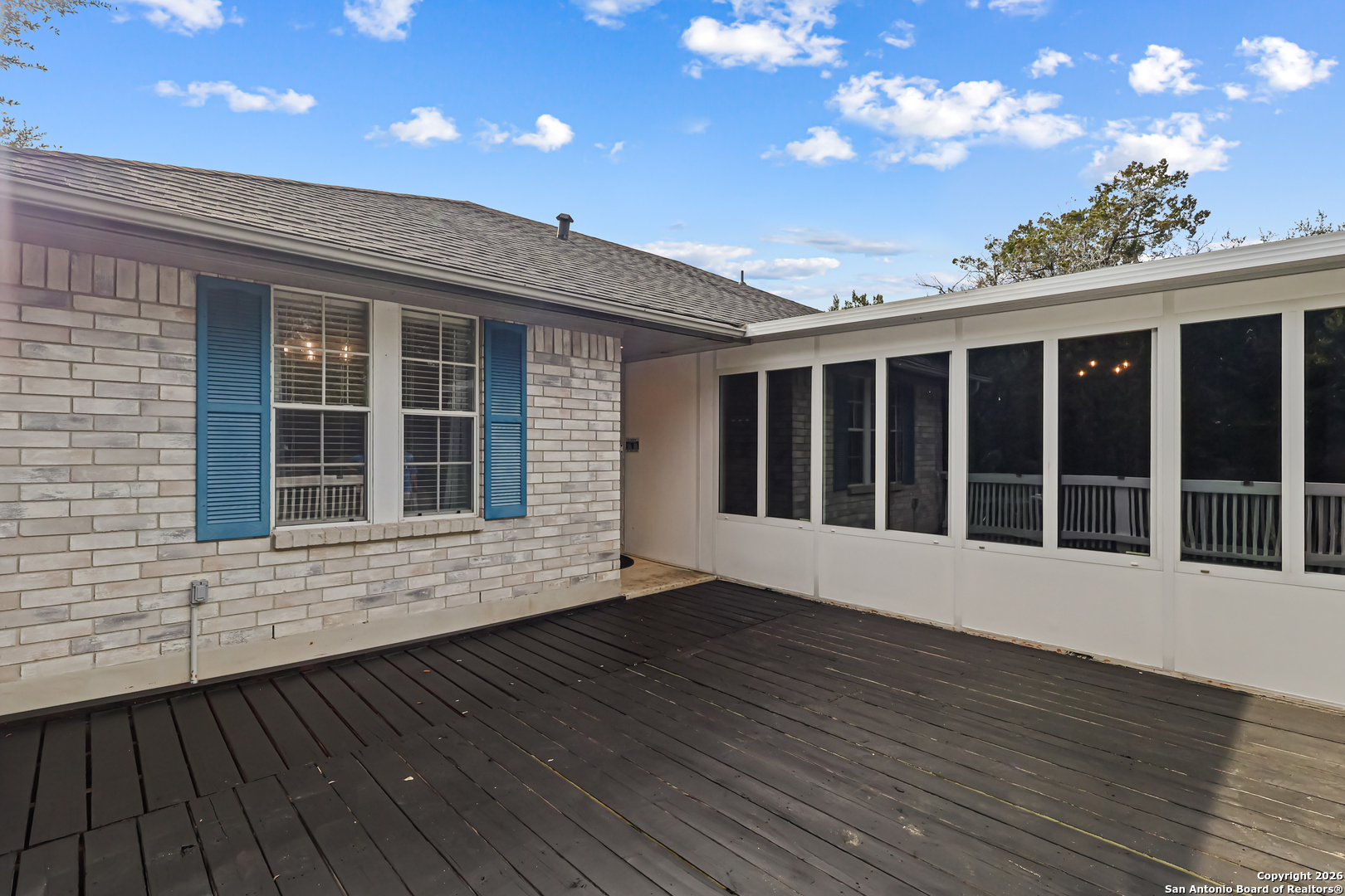162 Canyon View Court Spring Branch, TX 78070 - Photo 6 of 44 a view of an empty room with wooden floor and a window