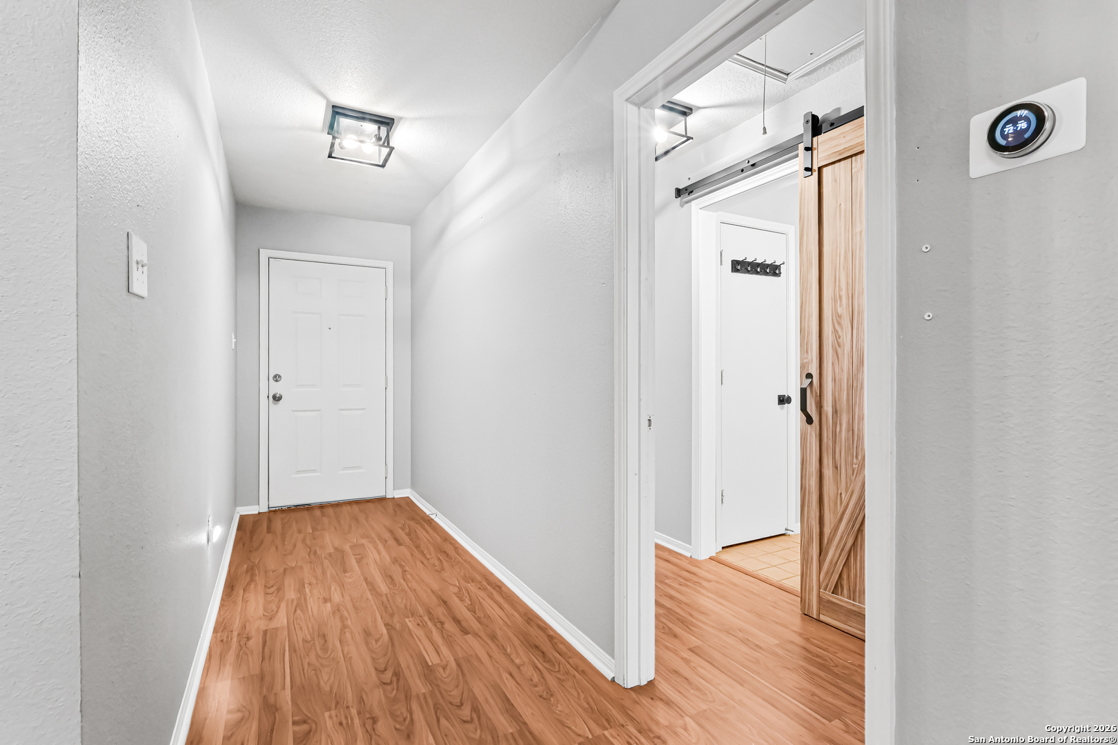 162 Canyon View Court Spring Branch, TX 78070 - Photo 7 of 44 a view of hallway with wooden floor