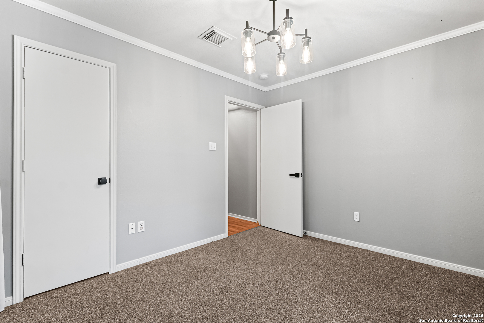 162 Canyon View Court Spring Branch, TX 78070 - Photo 9 of 44 an empty room with a chandelier fan and closet