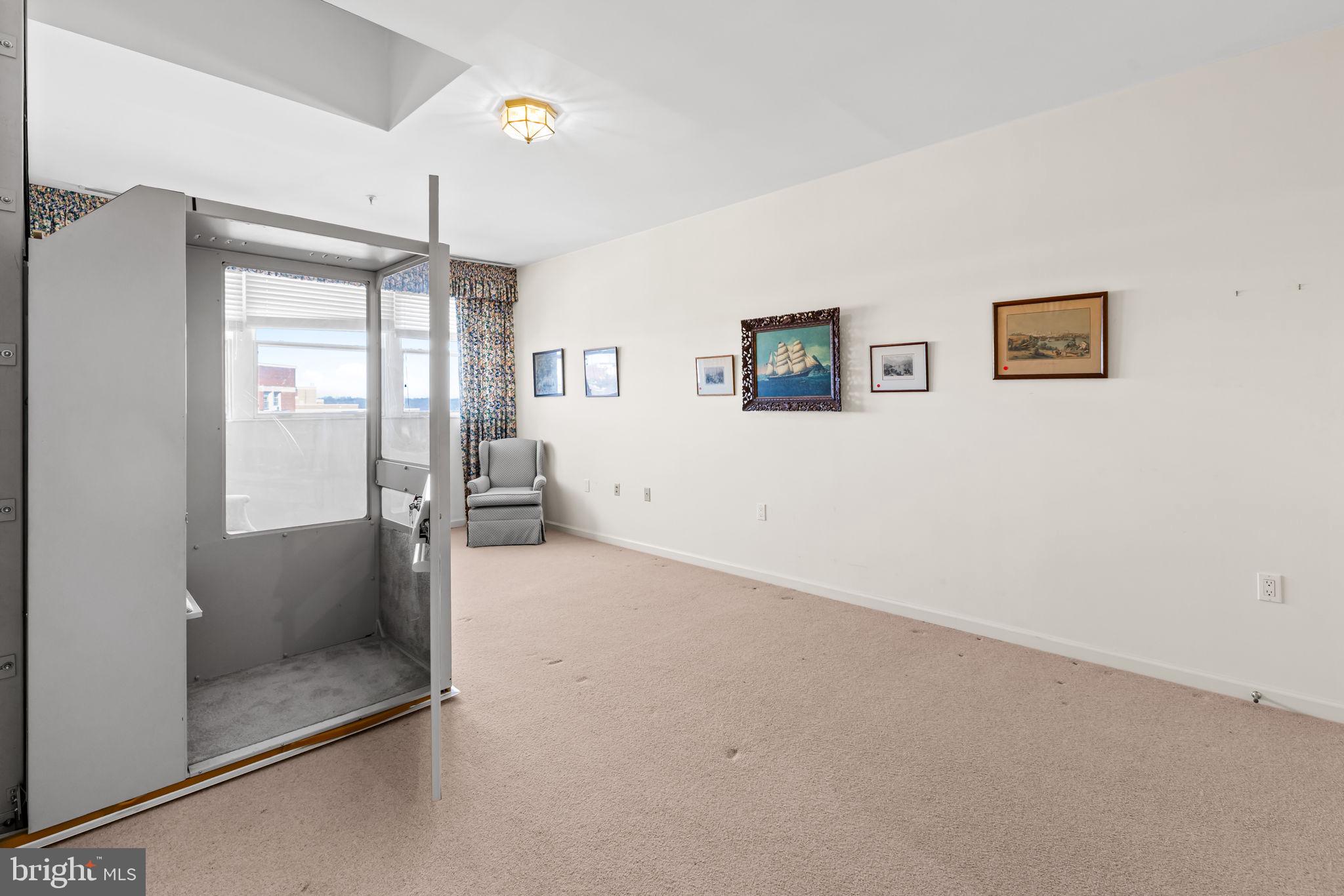 3801 Canterbury Road, Unit 1104 Baltimore, MD 21218 - Photo 52 of 74 a view of livingroom with hardwood floor and a ceiling fan