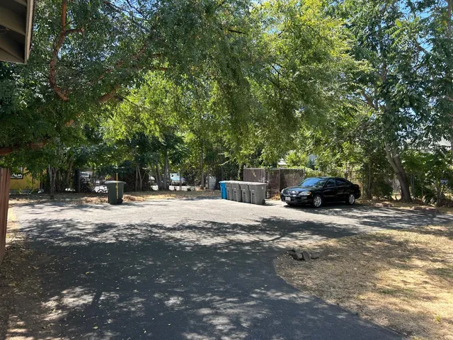 a view of street with parked cars