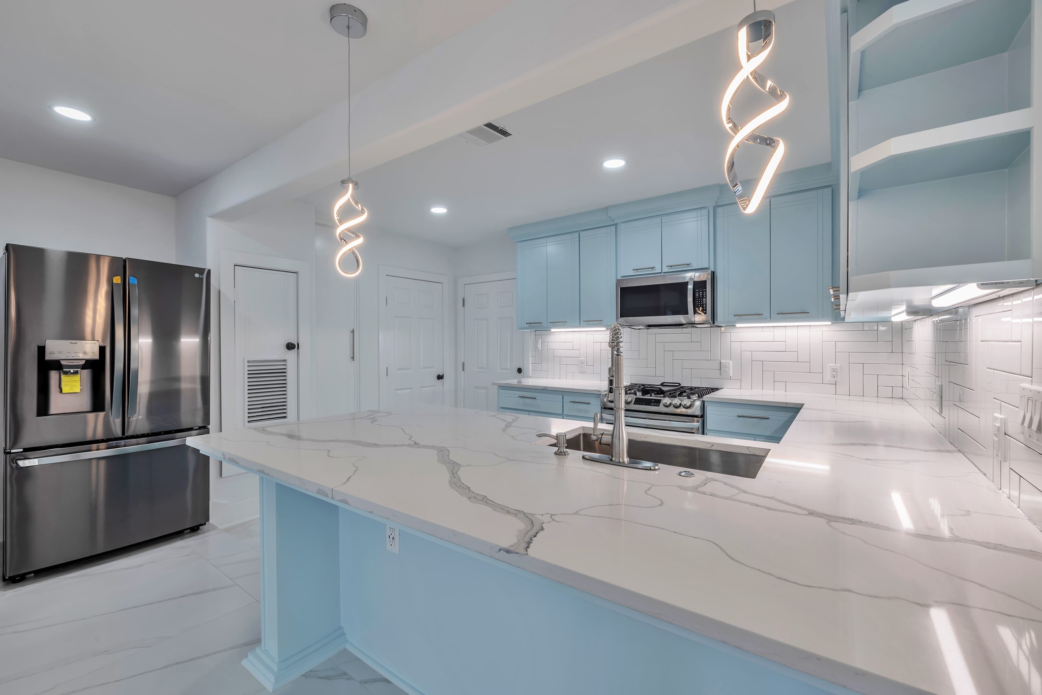 8709 Tarbell Road Houston, TX 77034 - Photo 8 of 25 a kitchen with stainless steel appliances granite countertop a sink and a stove