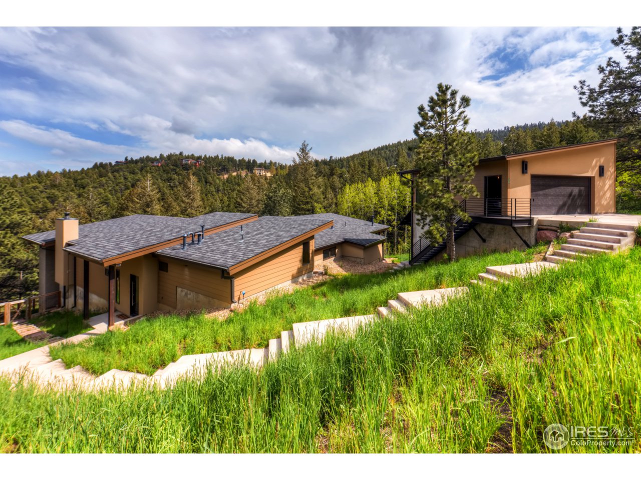 153 Brook Road Boulder, CO 80302 - Photo 1 of 25 a view of a house with a yard