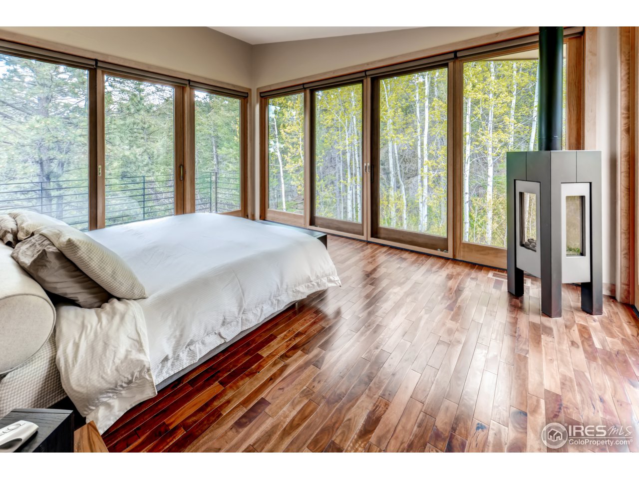 153 Brook Road Boulder, CO 80302 - Photo 11 of 25 a bedroom with a bed and a large window