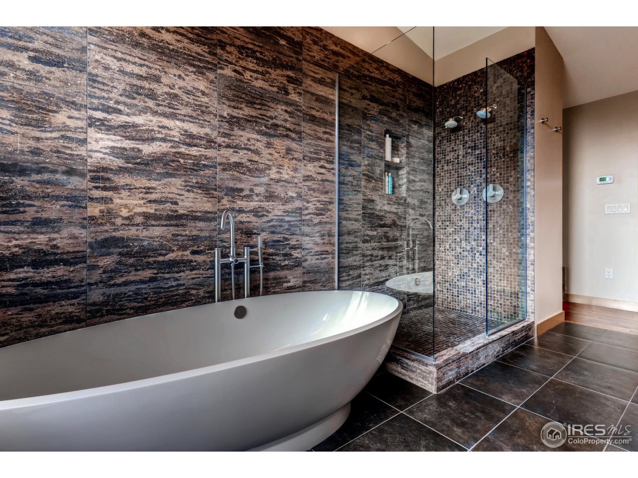 153 Brook Road Boulder, CO 80302 - Photo 14 of 25 a bathroom with a bathtub and shower