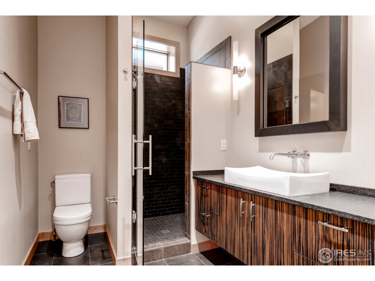 153 Brook Road Boulder, CO 80302 - Photo 17 of 25 a bathroom with a toilet sink a shower and a mirror