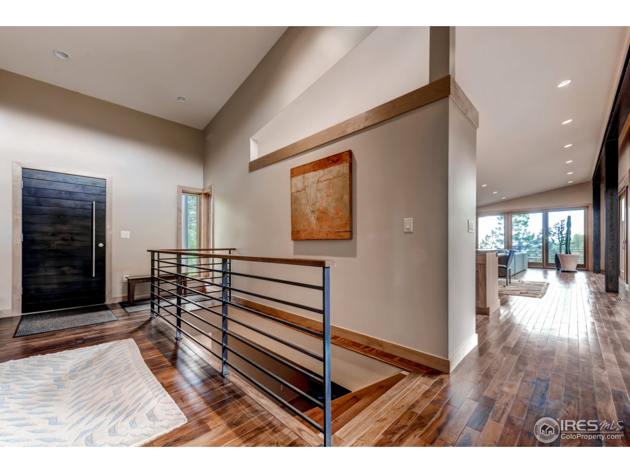 153 Brook Road Boulder, CO 80302 - Photo 3 of 25 a view of a hallway with wooden floor