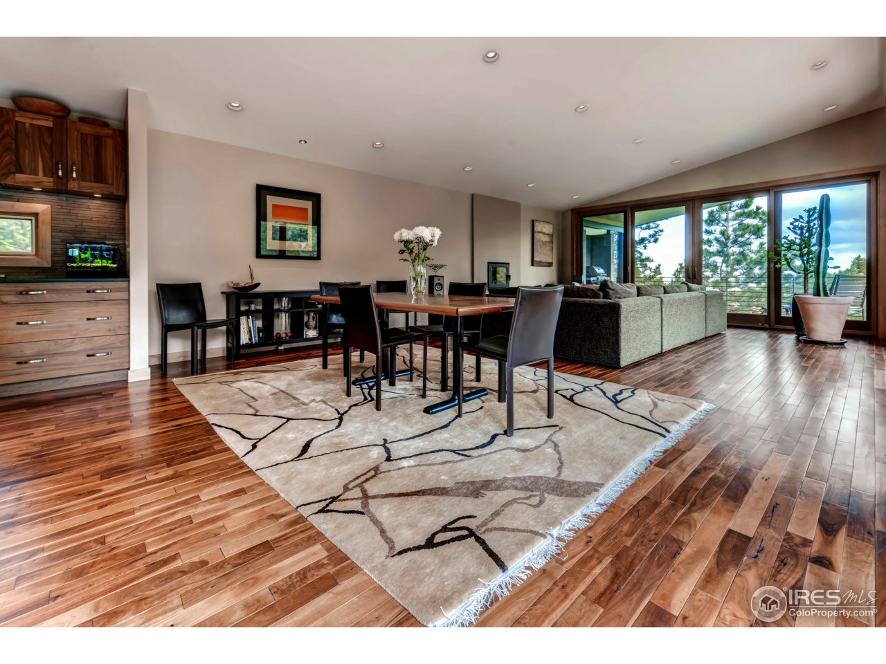 153 Brook Road Boulder, CO 80302 - Photo 9 of 25 a view of a dining hall with furniture and wooden floor