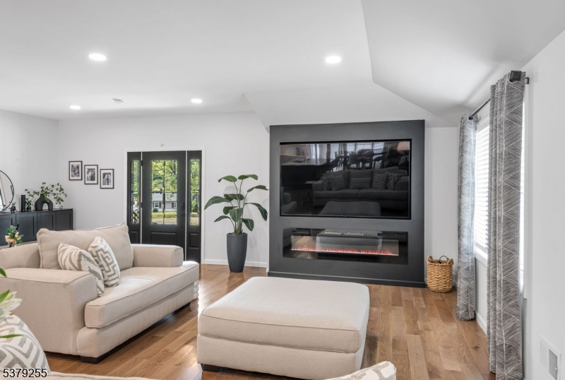 648 Black Oak Ridge Road Wayne, NJ 07470 - Photo 11 of 50 a living room with furniture and a flat screen tv