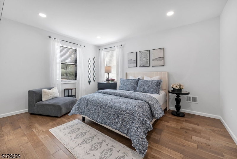 648 Black Oak Ridge Road Wayne, NJ 07470 - Photo 16 of 50 a bedroom with a bed and couch