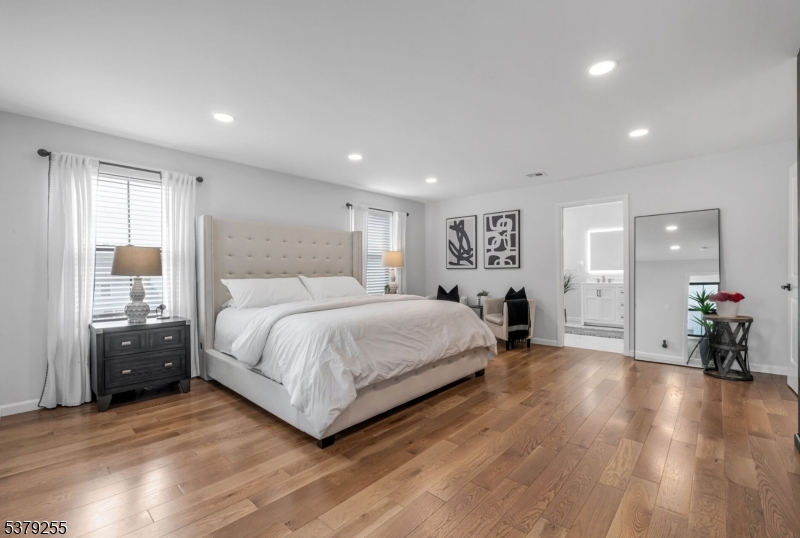 648 Black Oak Ridge Road Wayne, NJ 07470 - Photo 22 of 50 a spacious bedroom with a bed and a large window