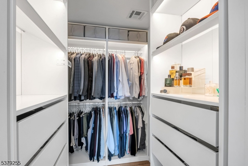 648 Black Oak Ridge Road Wayne, NJ 07470 - Photo 27 of 50 a view of walk in closet with clothes and shoes