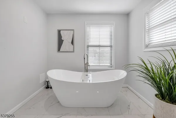a bathroom with a double vanity sink mirror double and shower