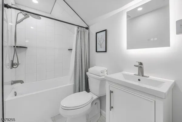 a bed room with a bed and a tv