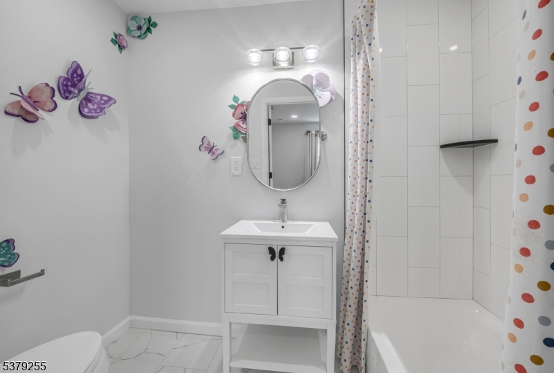 648 Black Oak Ridge Road Wayne, NJ 07470 - Photo 34 of 50 a bathroom with a sink and a mirror