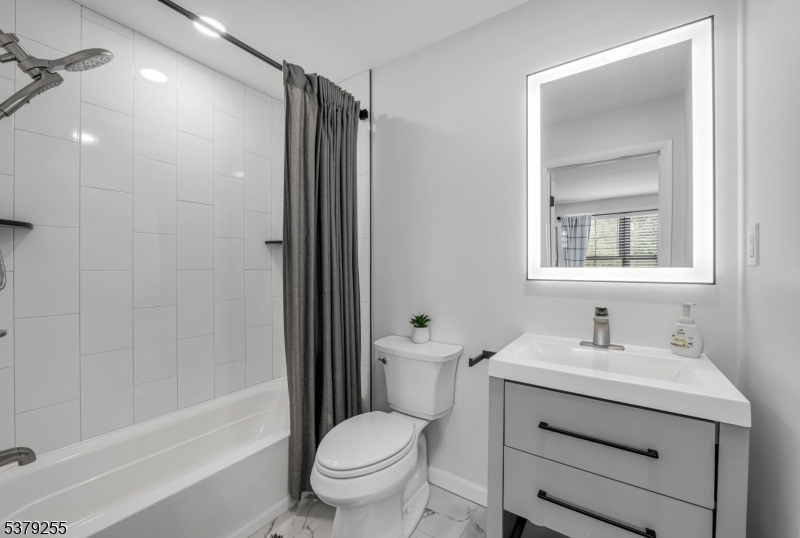 648 Black Oak Ridge Road Wayne, NJ 07470 - Photo 36 of 50 a bathroom with a sink toilet and shower