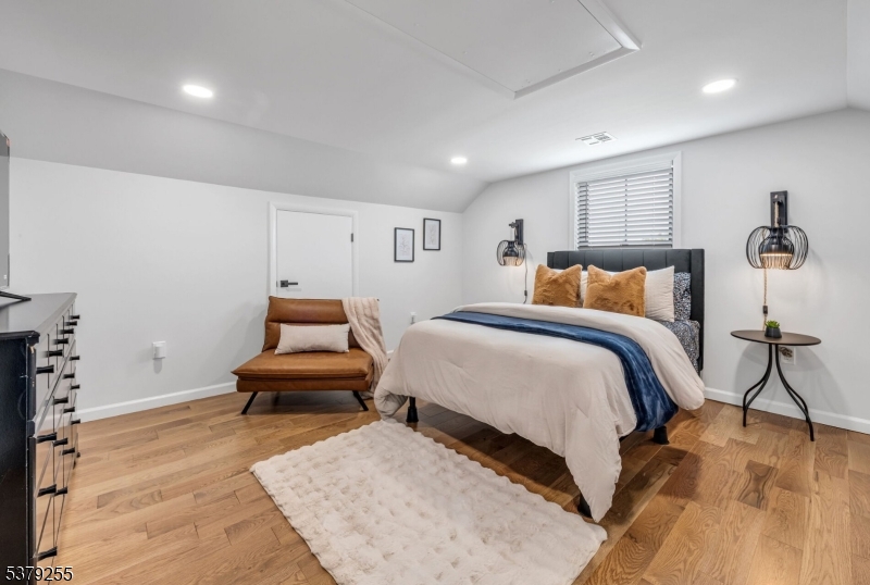 648 Black Oak Ridge Road Wayne, NJ 07470 - Photo 44 of 50 a bedroom with a bed and a couch