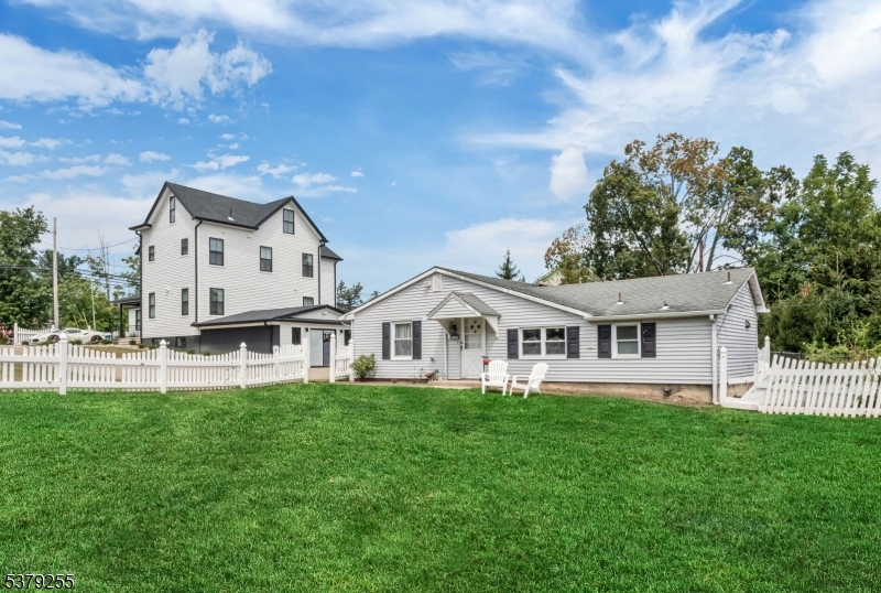 648 Black Oak Ridge Road Wayne, NJ 07470 - Photo 47 of 50 a front view of a house with a yard table and chairs