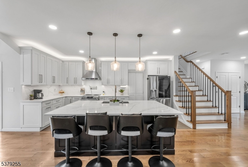648 Black Oak Ridge Road Wayne, NJ 07470 - Photo 10 of 50 a large kitchen with a table and chairs