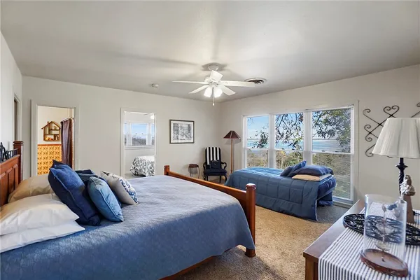 a view of a chairs and table on the roof deck