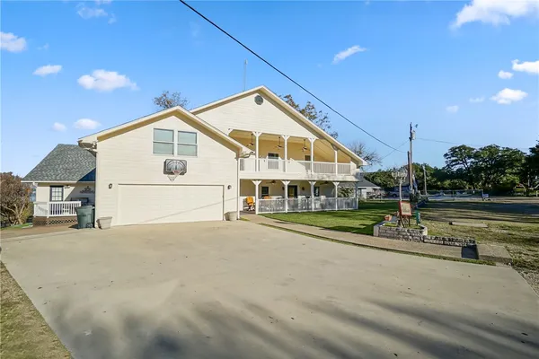 a outdoor space with lots of chairs and chandelier