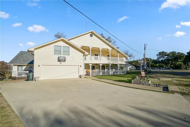 a outdoor space with lots of chairs and chandelier