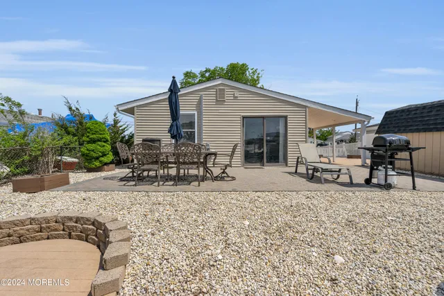 a house view with a sitting space and garden space