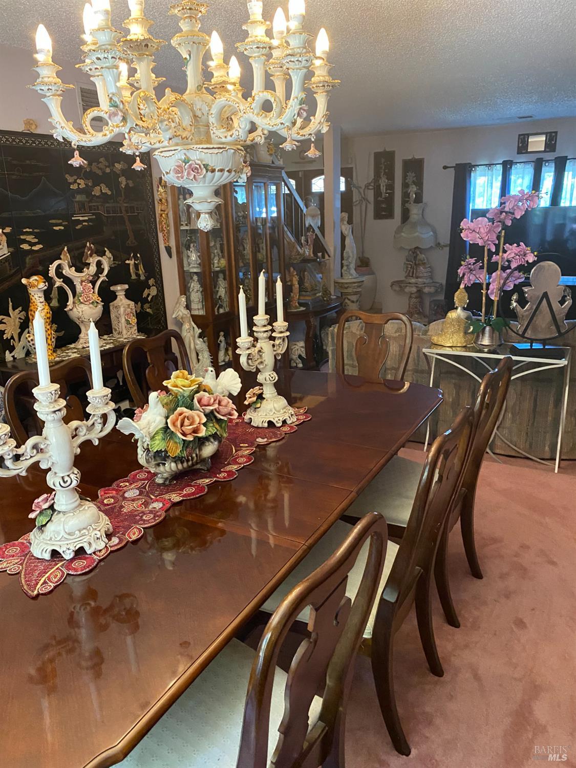 118 Hydrangea Court Vallejo, CA 94591 - Photo 11 of 21 a view of a dining room filled with furniture and chandelier