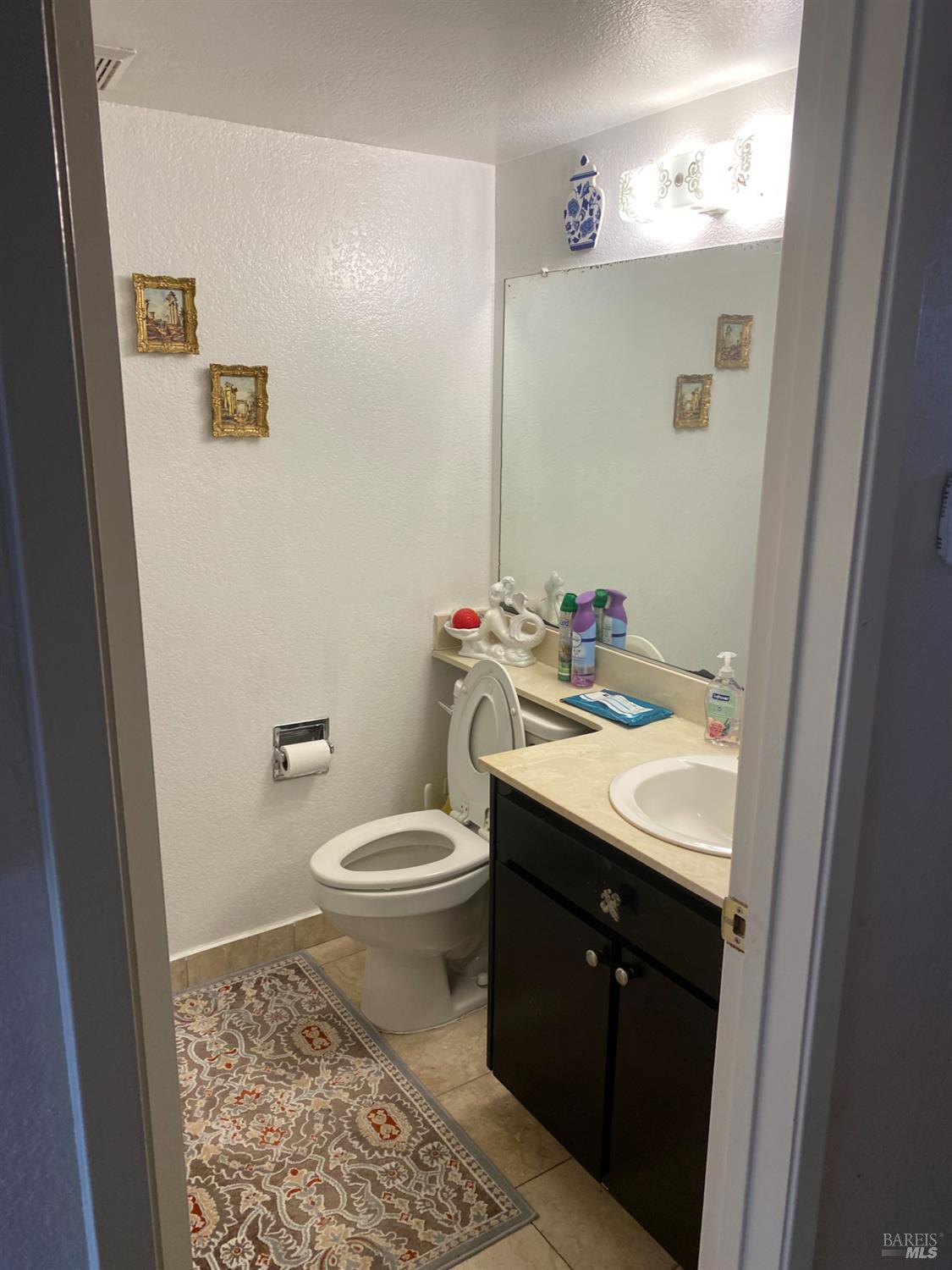 118 Hydrangea Court Vallejo, CA 94591 - Photo 16 of 21 a bathroom with a sink and a toilet