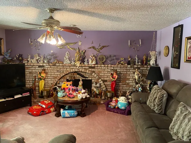 a kitchen with a stove a refrigerator and a wooden cabinets