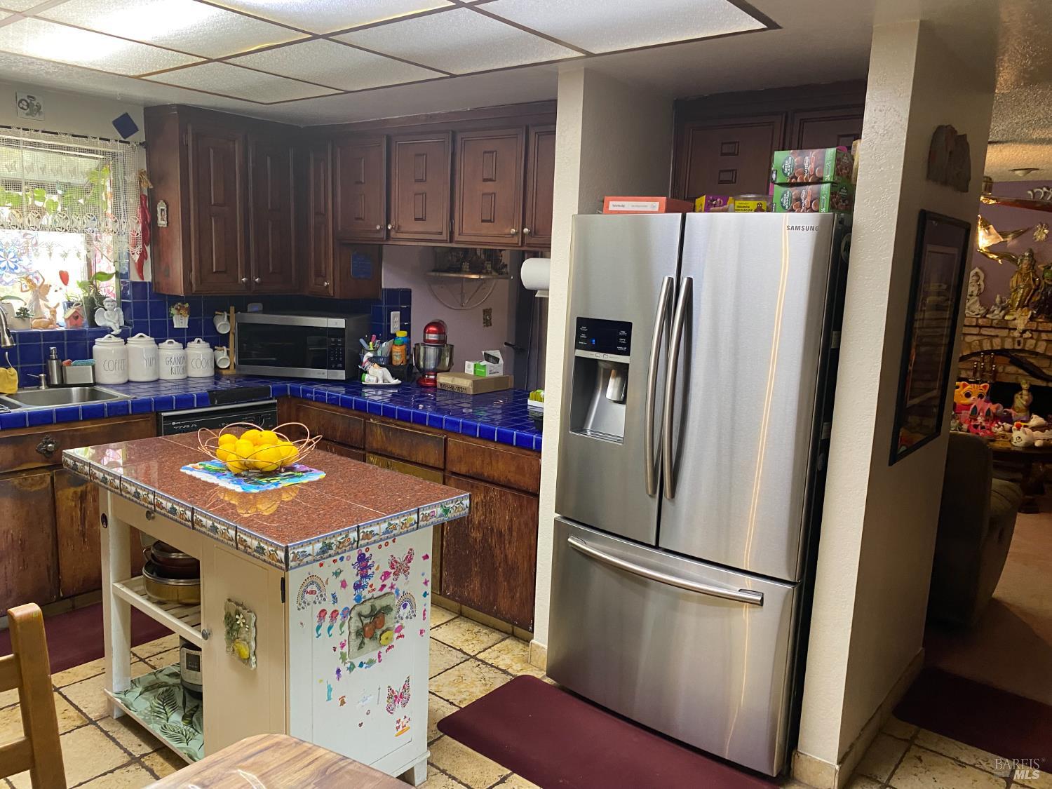 118 Hydrangea Court Vallejo, CA 94591 - Photo 8 of 21 a kitchen with stainless steel appliances granite countertop a refrigerator a stove and a sink