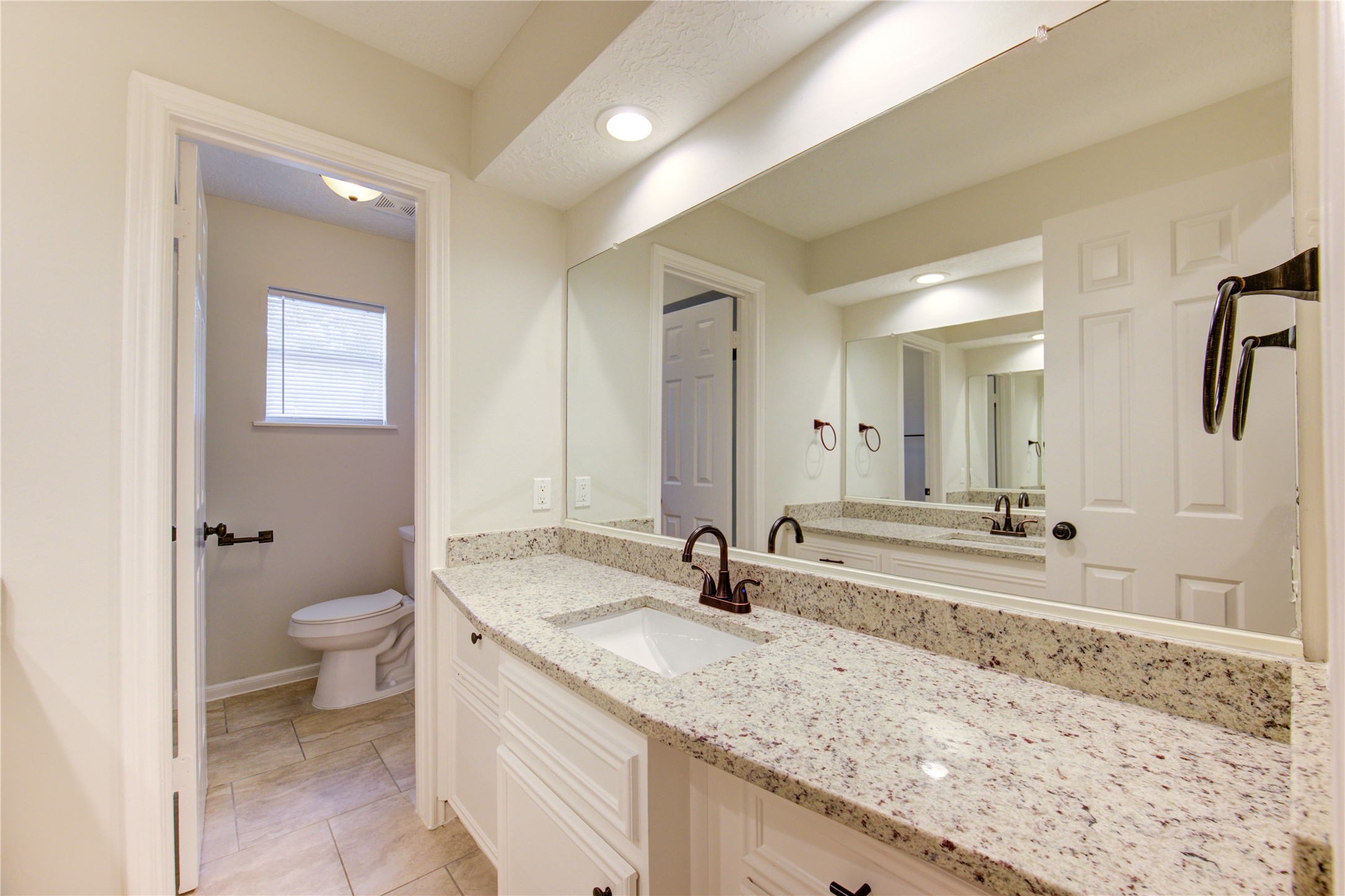 9115 Taidswood Drive Spring, TX 77379 - Photo 31 of 45 The upstairs bath has a granite counter top, recessed LED lighting and a full mirror. This bathroom also has 2 sinks!