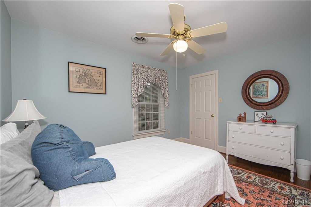 2306 Cranborne Road Midlothian, VA 23113 - Photo 17 of 23 a bedroom with a bed and a chandelier