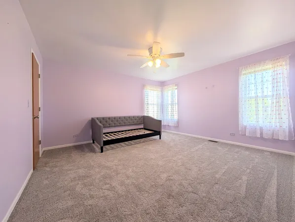 an empty room with a empty space and windows