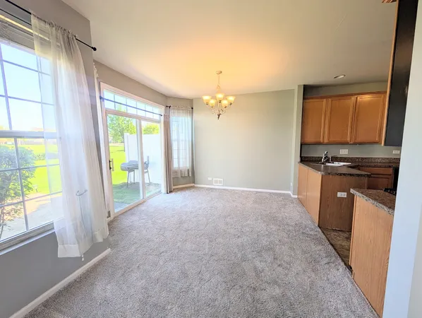 a view of kitchen and front door