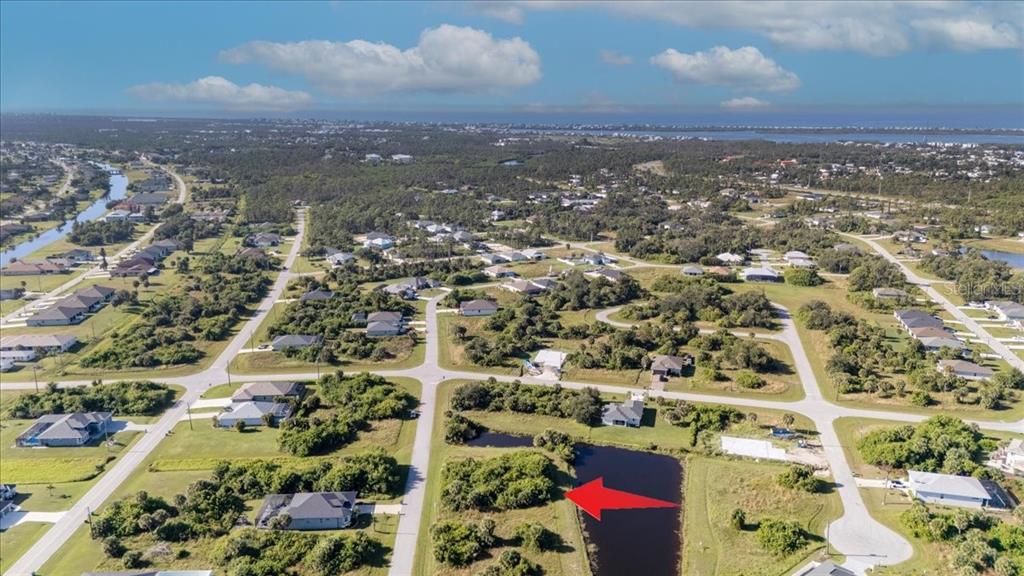 153 Spring Drive Rotonda West, FL 33947 - Photo 12 of 13 an aerial view of residential building and city