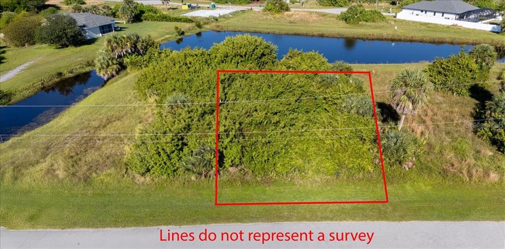 153 Spring Drive Rotonda West, FL 33947 - Photo 3 of 13 a view of a garden