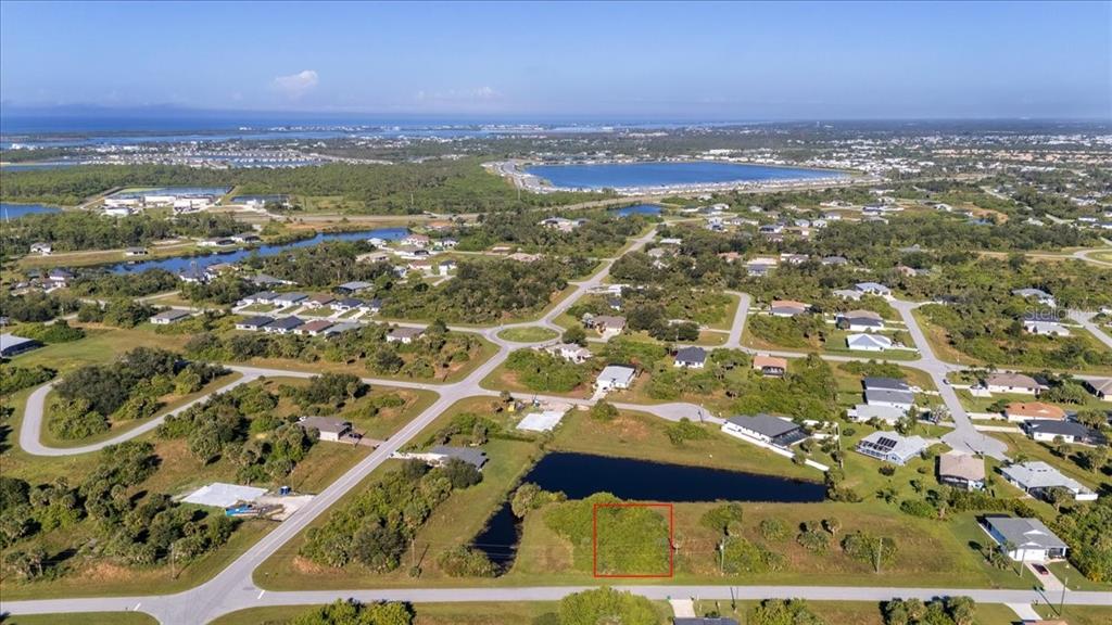 153 Spring Drive Rotonda West, FL 33947 - Photo 6 of 13 an aerial view of residential houses with outdoor space