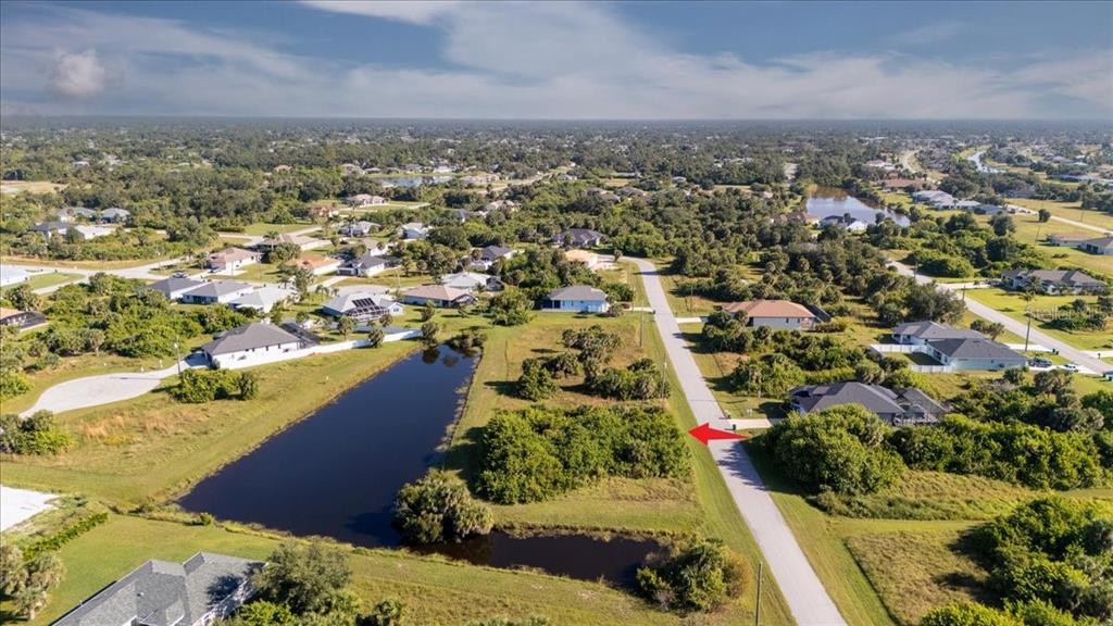 153 Spring Drive Rotonda West, FL 33947 - Photo 8 of 13 an aerial view of residential houses with outdoor space