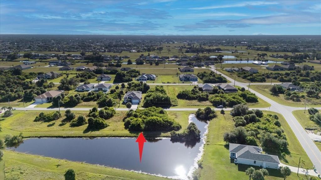 153 Spring Drive Rotonda West, FL 33947 - Photo 9 of 13 an aerial view of residential houses with outdoor space